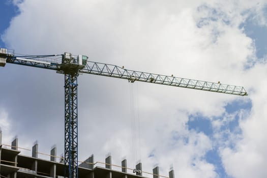 construction of a residential building. tower crane on the construction site