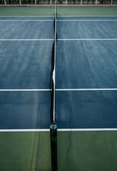 Empty sport field photo. Hard court cover for lawn tennis. Summer sport activity outdoor.  Sport field in park