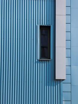details of aluminum facade and aluminum panels with window on industrial building