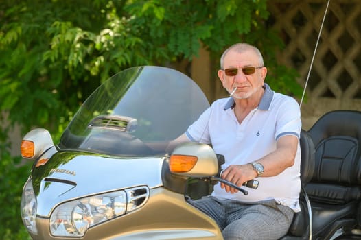 elderly man sitting on a motorcycle 5