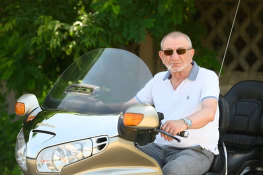 elderly man sitting on a motorcycle 4