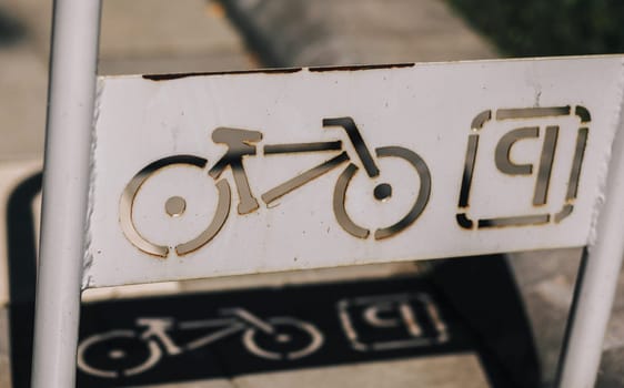 Metal Bicycle Parking sign near Campus