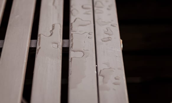 wet bench with drops of water after the rain