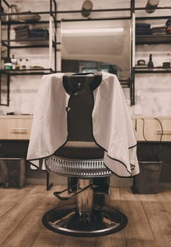 Barbershop theme. Barber shop chair. Stylish vintage barber chair. Barbershop armchair, modern hairdresser