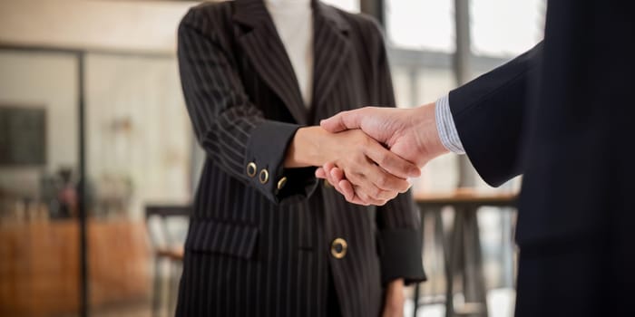 Handshake of two business people after contract agreement to become a partner, collaboration teamwork.
