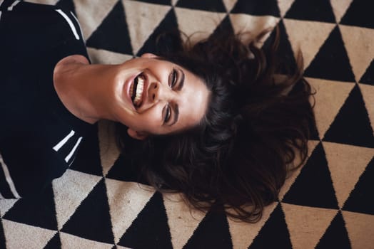 Woman, lying or laugh in beauty, fashion and designer style as monochrome, abstract or aesthetic. Smile, female person and glow as luxury, pattern or texture of fabric in retro, vintage or above.