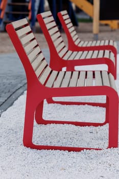 red wooden chairs on the street. a place to relax