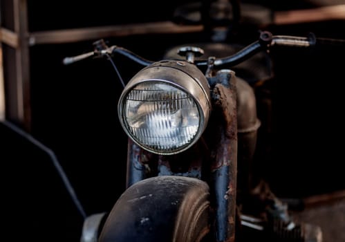 Close up shot of a vintage motorcycle headlight