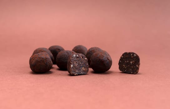 Vegan Raw Sweet Balls made of Organic Cocoa beans With Dry Citrus Fruits on Brown Background. Cop Space. Mockup Horizontal Plane. Healthy Food, Dessert High quality photo