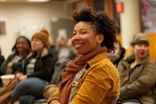 A woman speaks at a community-led mental health awareness workshop. Sunlight filters through the windows, highlighting the engagement of diverse participants