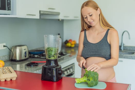 Embracing a nutritious choice, a pregnant woman joyfully prepares a vibrant vegetable smoothie, prioritizing wholesome ingredients for optimal well-being during her maternity journey.