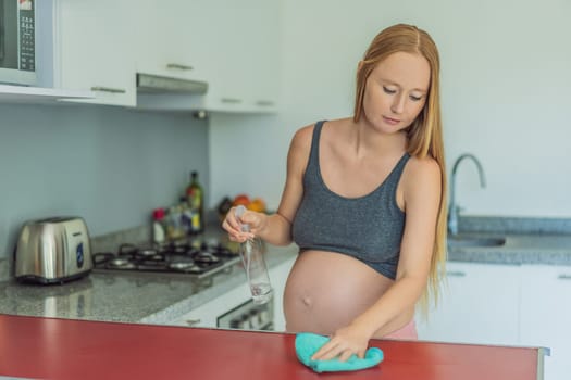 Efficient and dedicated, a pregnant woman tackles kitchen chores, ensuring a clean and organized space, exemplifying resilience and care during her pregnancy.