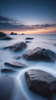 Long exposure image of a long exposure of the sea and rocks at sunset.Long exposure of a rocky seashore at sunset. Long exposure photography.Long exposure seascape. Long exposure image of long exposure seascape with long exposure effect.
