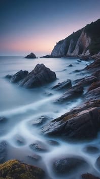 Long exposure image of a long exposure of the sea and rocks at sunset.Long exposure of a rocky seashore at sunset. Long exposure photography.Long exposure seascape. Long exposure image of long exposure seascape with long exposure effect.