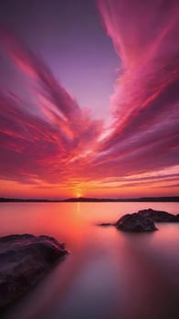 Beautiful sunset over the sea with pink and purple colors, long exposure.Dramatic sky. Landscape ans seascape for background.