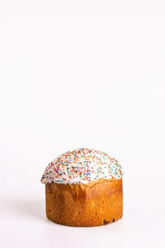 Kulich is a Russian Easter bread with sweet yeast dough, raisins, dried fruits, white icing, colorful sprinkles. Traditional festive treat.