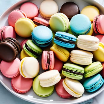  vibrantly colored macarons on a plate, showcasing a variety of flavors and fillings.