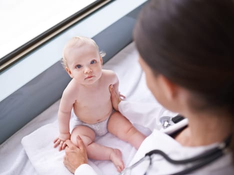 Baby, portrait and pediatrician consultation for healthcare checkup on hospital bed for diagnosis, insurance or childcare. Kid, face and medical worker for sick treatment, examination or stethoscope.