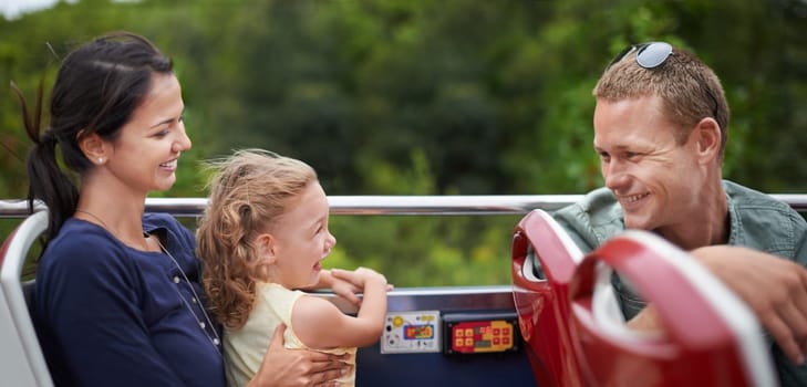 Amusement park, smile and happiness for family with toddler, mother and father together with kid. Holiday, woman and man with girl in transport for fun, laughter and joy with child in America.