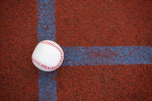 one baseball on infield of sport field. High quality photo