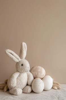 A plush white bunny with three textured Easter eggs on a soft beige background, ideal for calm, cozy spring holiday visuals or gentle nursery art. Greeting card. Generative AI