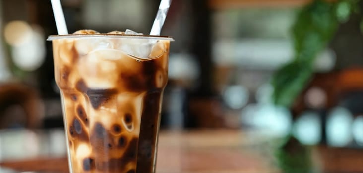 Milk Being Poured Into Iced Coffee on a dark table. Generative AI