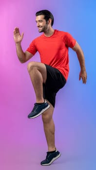 Full body length gaiety shot athletic and sporty young man fitness running cardio exercise posture on isolated background. Healthy active and body care lifestyle.