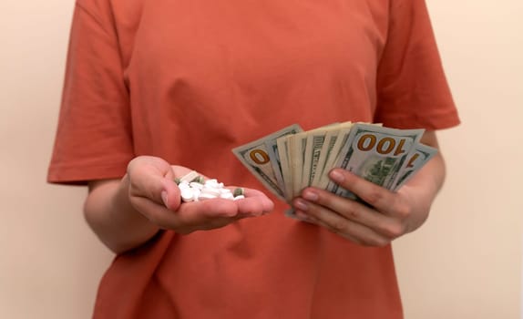 Mockup White Cropped Woman Holds Heap Of Pills, Tablets, Supplement, Vitamins And Money, Wad Of Dollar Cash Banknotes . Horizontal Plane. Closeup High quality photo
