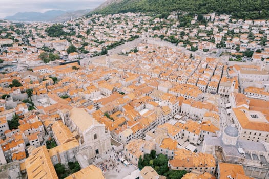 Square in front of the Cathedral of St. Ignatius against the backdrop of old stone buildings. Dubrovnik, Croatia. Drone. High quality photo