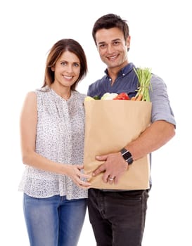 Happy couple, portrait and bag with groceries for food, natural sustainability or fashion on a white studio background. Man and woman with smile for grocery shopping, casual clothing or supermarket.