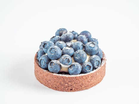Blueberries mini tart on transparent white background. Fresh blueberry tart as summer food concept isolated on transparent background