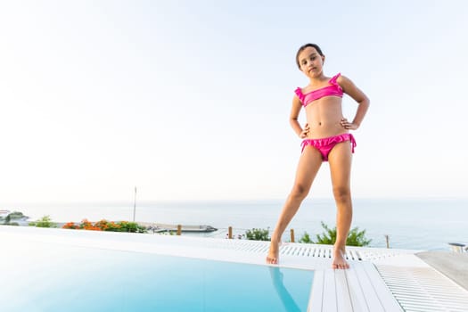 happy girl in the swimming in swimming suit