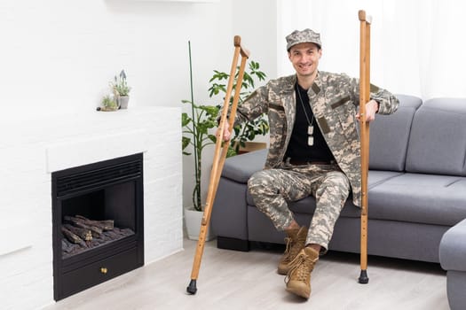 military man with crutches, disability.