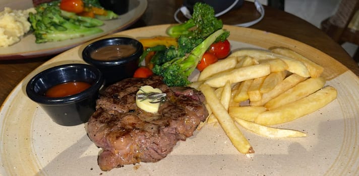 prime sirloin beef steak along with mash potatoes with delicious mushroom sauce and green salad onion new york sirloin