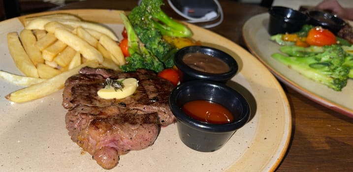 prime sirloin beef steak along with mash potatoes with delicious mushroom sauce and green salad onion new york sirloin