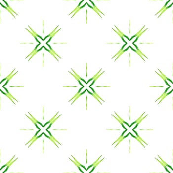 Textile ready unusual print, swimwear fabric, wallpaper, wrapping. Green charming boho chic summer design. Watercolor ikat repeating tile border. Ikat repeating swimwear design.