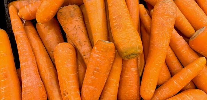 Macro photo of carrot spring food vegetable. Fresh big orange carrot texture background. Product Image of Carrot Root Vegetables