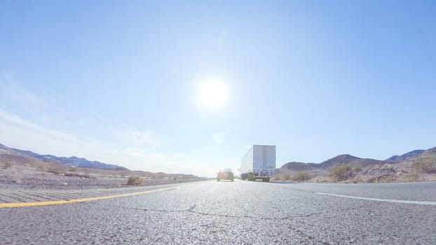 Embarking on a road trip from Nevada to California, driving on Highway 15 during the day offers scenic views and an exciting journey between states.