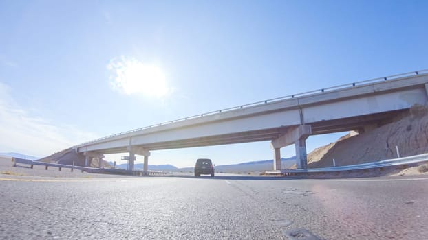 Embarking on a road trip from Nevada to California, driving on Highway 15 during the day offers scenic views and an exciting journey between states.