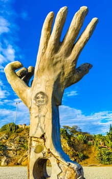 Puerto Escondido Oaxaca Mexico 01. December 2022 Hands made of stone rock statue sculpture on the beach in Zicatela Puerto Escondido Oaxaca Mexico.