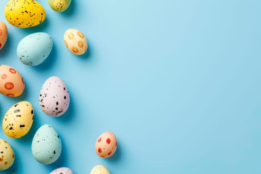 Collection of vibrant Easter eggs painted in various colors displayed on a plain blue background.
