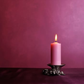 A single pink candle burning brightly on a vintage metal holder against a purple background.