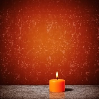 A single lit orange candle against a red textured backdrop.