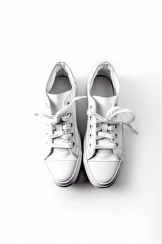 A pair of clean white sneakers against a white background.