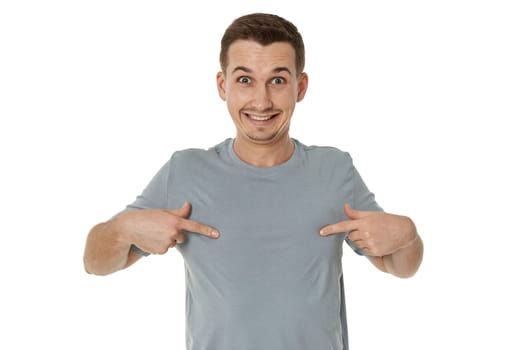 happy guy looking pointing at himself on white studio background