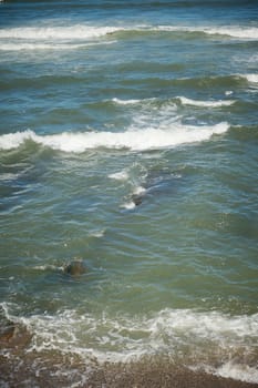 View from above of sea waves pounding on the headland. Atlantic ocean background. Nature background