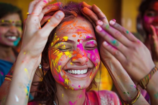 A young girl's face lights up with joy, smeared with vibrant colors during the Holi festival. This moment of pure happiness and cultural tradition shines through
