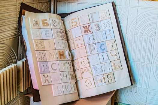 Cyrillic alphabet book, Designer book with Russian and Ukrainian alphabet, with different textures. Kharkiv Ukraine 05-05-2023