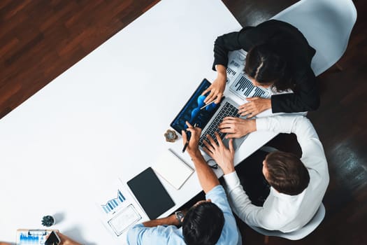 Group of office worker and businesspeople working on business financial data analysis. Empty space with editable blank background meeting table for customer design. Prudent