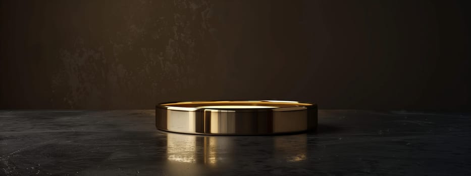 A gold ring, a fashion accessory, is elegantly displayed on a sleek black table. The contrast of metal and wood creates a luxurious vibe